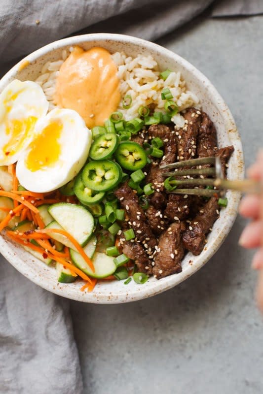 <p>Little Spice Jar</p><p>Hearty Korean BBQ bowls made with bulgogi beef, garlic-scented rice, quick cucumber carrot salad and half-boiled eggs. These bowls are warm, comforting and loaded with protein.</p><p><strong>Get the recipe: <a href="https://littlespicejar.com/korean-bbq-bowls-garlic-scented-rice/" rel="nofollow noopener" target="_blank" data-ylk="slk:Korean BBQ Bowls with Garlic Scented Rice;elm:context_link;itc:0;sec:content-canvas" class="link ">Korean BBQ Bowls with Garlic Scented Rice</a></strong></p><p><strong>Related: <a href="https://parade.com/1169903/felicialim/korean-recipes/" rel="nofollow noopener" target="_blank" data-ylk="slk:25 Authentic Korean Recipes;elm:context_link;itc:0;sec:content-canvas" class="link ">25 Authentic Korean Recipes</a></strong></p>