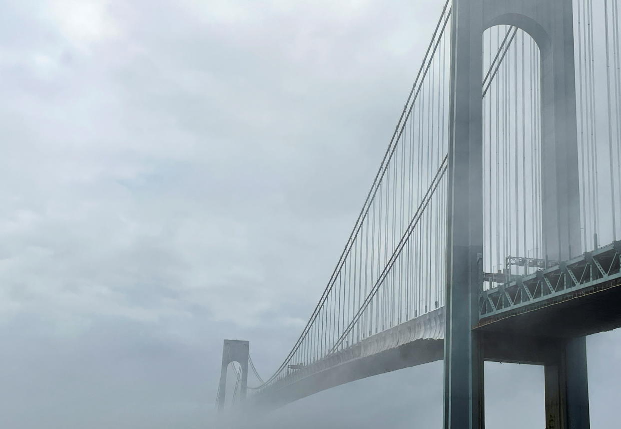 The Verrazzano-Narrows bridge connecting the Brooklyn and Staten Island boroughs is pictured in morning fog in New York City, New York, U.S., June 26, 2021. Picture taken June 26, 2021. REUTERS/Nick Zieminski