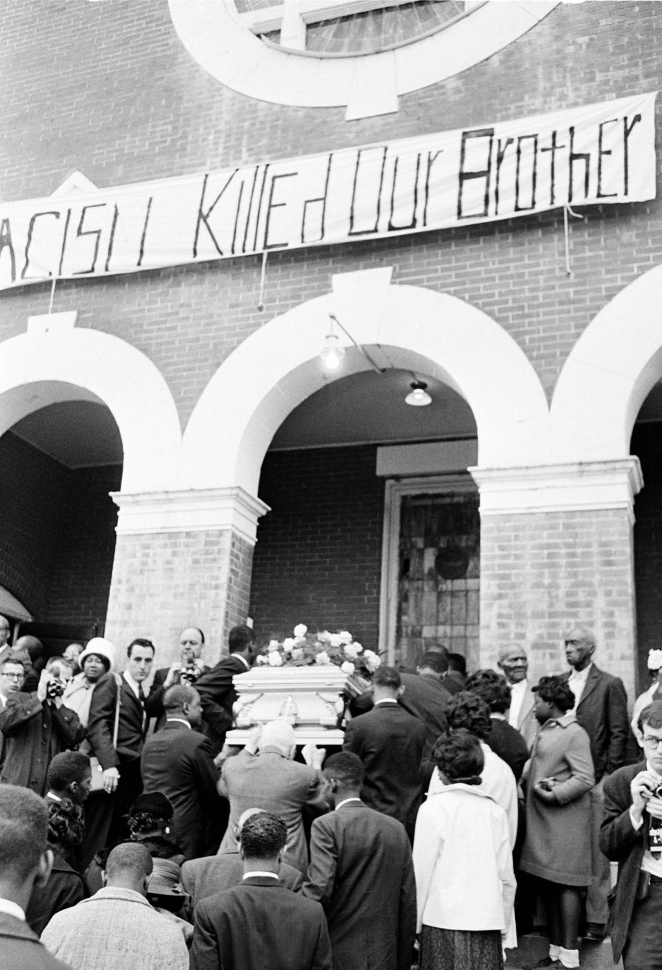 FILE - The casket bearing the body of Jimmie Lee Jackson is carried into a church in Selma, Ala., for funeral services on March 3, 1965, photo. Jackson, was killed during an outbreak of racial violence during a demonstration at nearby Marion, Ala. Andrew Young, one of the last surviving members of Martin Luther King Jr.'s inner circle, recalled the journey to the signing of the Voting Rights Act as an arduous one, often marked by violence and bloodshed. (AP Photo)