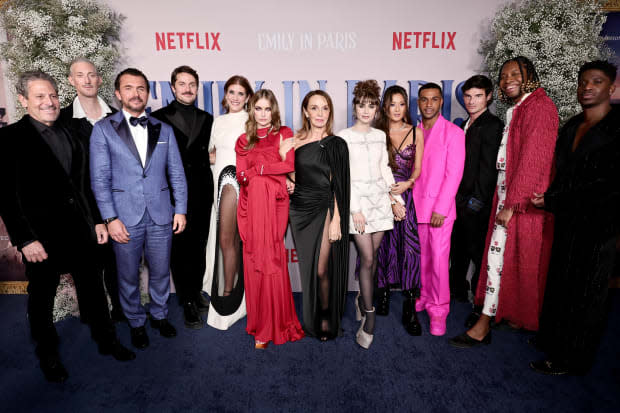 (L-R) Darren Starr, Bruno Gouery, William Abadie, Lucas Bravo, Kate Walsh, Camille Razat, Philippine Leroy-Beaulieu, Lily Collins, Ashley Park, Lucien Laviscount, Paul Forman, JeremyO. Harris, and Samuel Arnold<p><a href="https://www.gettyimages.com/detail/1449510117" rel="nofollow noopener" target="_blank" data-ylk="slk:Jamie McCarthy/Getty Images" class="link ">Jamie McCarthy/Getty Images</a></p>