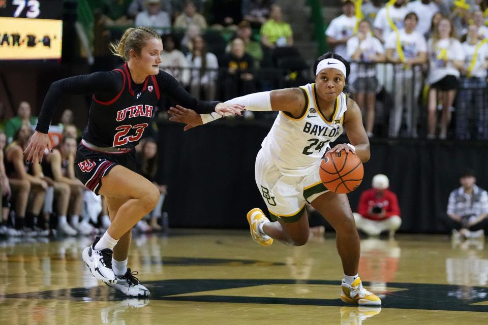 Baylor’s Sarah Andrews, right, attacks against Utah’s Matyson Wilke during the second half of an NCAA college basketball game, Tuesday, Nov. 14, 2023, in Waco, Texas. Baylor won 84-77. | Julio Cortez, Associated Press