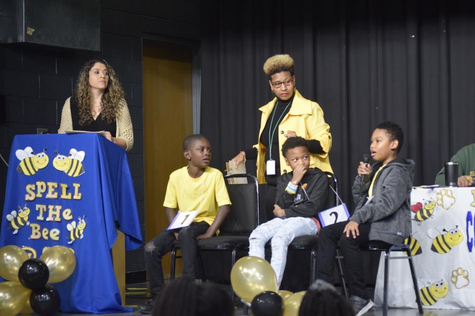 Spanish teacher Yaqueline Garcia, top-left, and instructional specialist LaTonga Williams, top-center, listens to fourth-grader Mason Page, bottom-right, spell a word during Copeland Elementary School's annual Spanish Spelling Bee on Thursday, Nov. 17 2022 in Augusta, Ga.