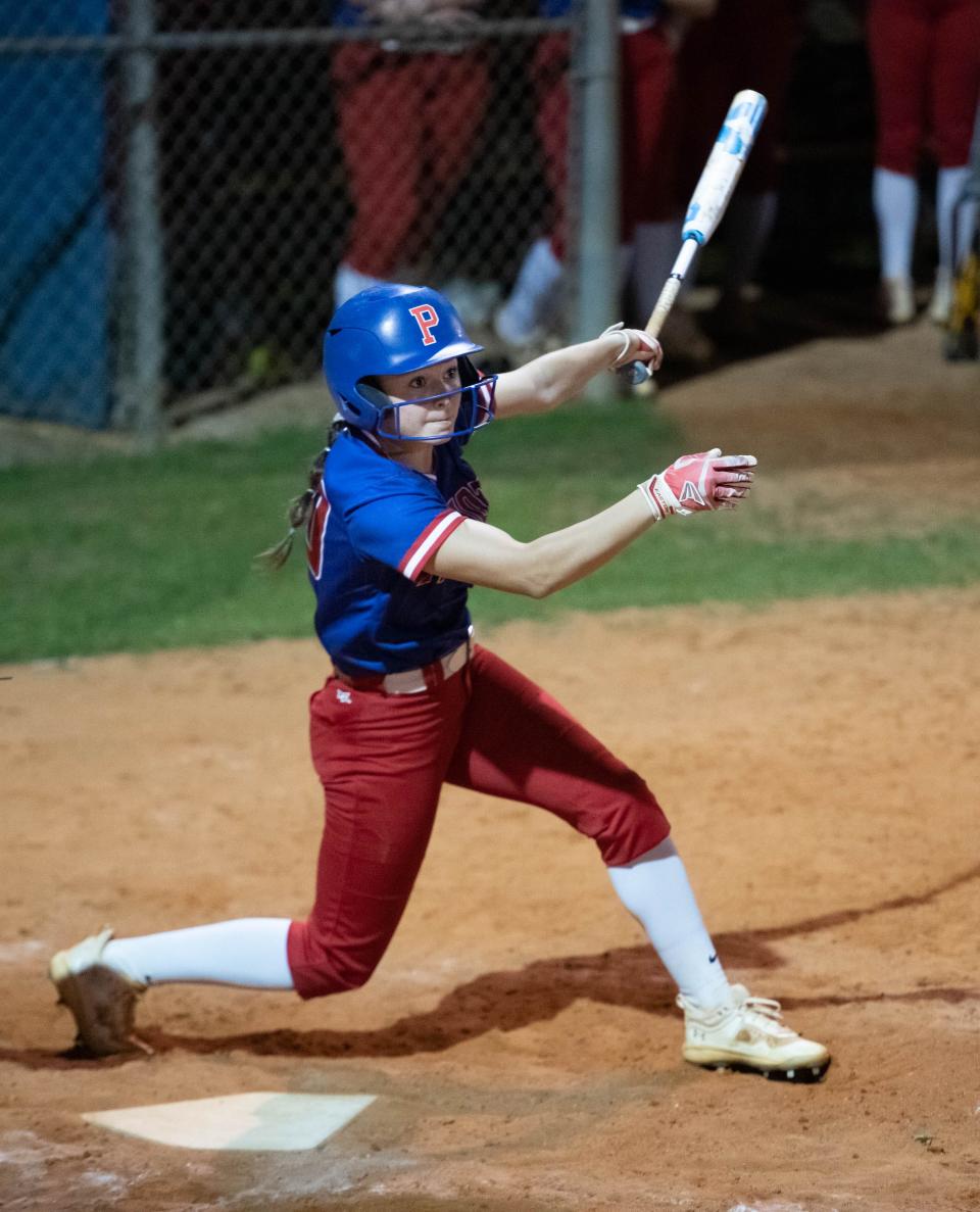 Mallory Baker (30) slaps a shot that falls in front of (11) for a single during the South Warren vs Pace softball game at Pace High School on Wednesday, April 5, 2023.