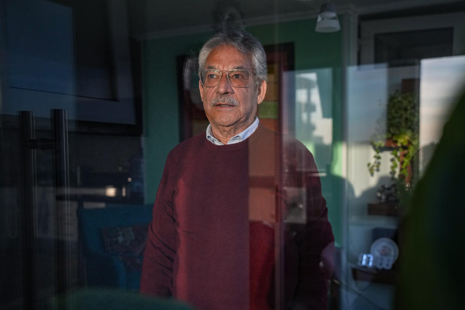 Guillermo Hormazábal, a Chilean journalist who served as the Vicariate of Solidarity's communications director, poses for a photo in his apartment in Vina del Mar, Chile, Thursday, July 27, 2023. Although the investigative police kidnapped him in 1980, he was released within 24 hours thanks to media pressure exerted by the church-owned radio station where he worked. “The church was the only counterweight to the dictatorship,” he said. “It was a church that was not in the sacristy, but with the people.” (AP Photo/Esteban Felix)