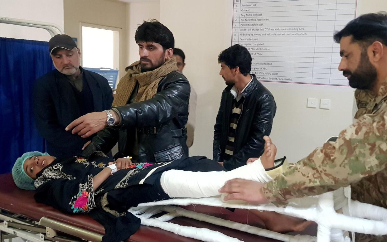 Samina Bibi, 12, in hospital after being rescued from under the snow in Bakwali village, Neelum Valley, Kashmir - REUTERS