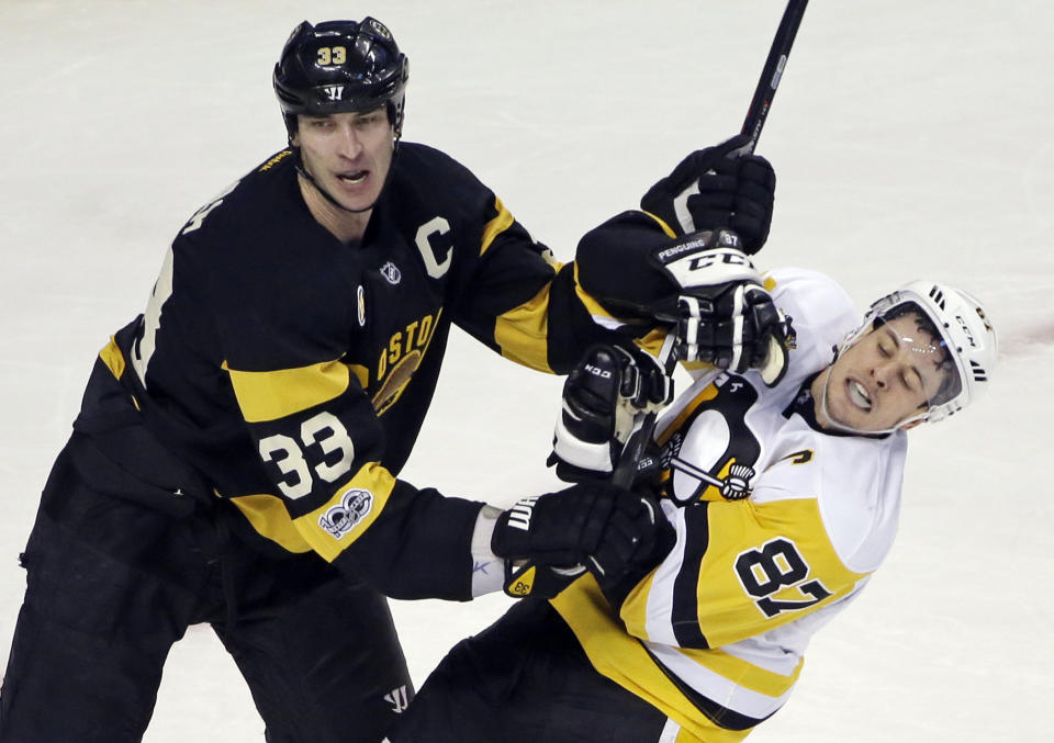FILE - In this Thursday, Jan. 26, 2017 file photo, Boston Bruins defenseman Zdeno Chara (33) pushes Pittsburgh Penguins center Sidney Crosby (87) from the crease in the third period of an NHL hockey game in Boston. Longtime Boston Bruins captain Zdeno Chara signed with the Washington Capitals on Wednesday, Dec. 30, 2020, a stunning move less than a week before most NHL teams open training camp. (AP Photo/Elise Amendola, File)
