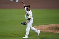 San Diego Padres relief pitcher Trevor Rosenthal celebrates after the Padres defeated the St. Louis Cardinals 4-0 in Game 3 of a National League wild-card baseball series Friday, Oct. 2, 2020, in San Diego. The Padres advanced to the Division Series. (AP Photo/Gregory Bull)