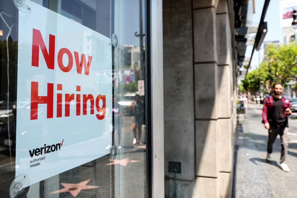 LOS ANGELES, CALIFORNIA - JULY 26: A 'Now Hiring' sign is posted at a Verizon store on July 26, 2022 in Los Angeles, California. As the Federal Reserve continues to increase interest rates, the labor market is starting to show signs of slowing down. (Photo by Mario Tama/Getty Images)