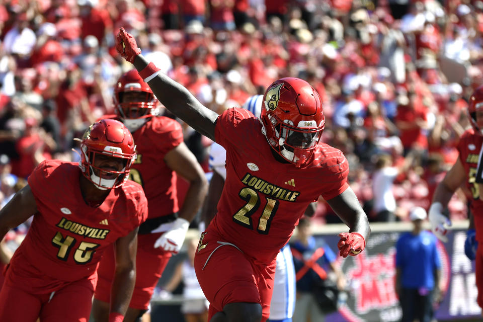 Louisville running back Donald Chaney (21) celebrates after scoring a touchdown during the second half of an NCAA college football game against SMU in Louisville, Ky., Saturday, Oct. 5, 2024.(AP Photo/Timothy D. Easley)