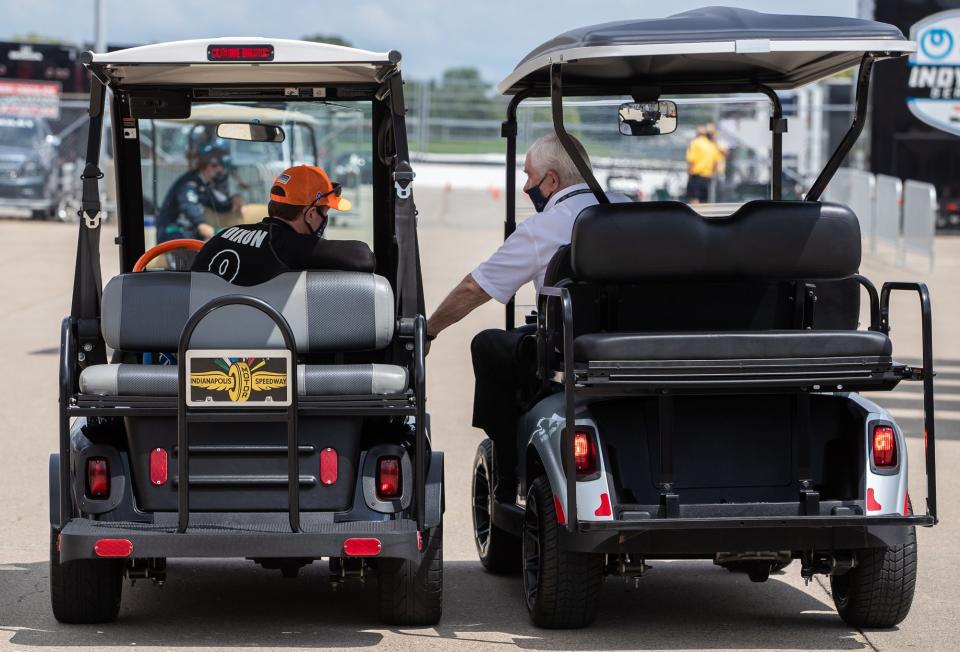 Chip Ganassi Racing driver Scott Dixon (9) talks with Indianapolis Motor Speedway and IndyCar owner Roger Penske during rookie practice on Wednesday, Aug. 12, 2020. 