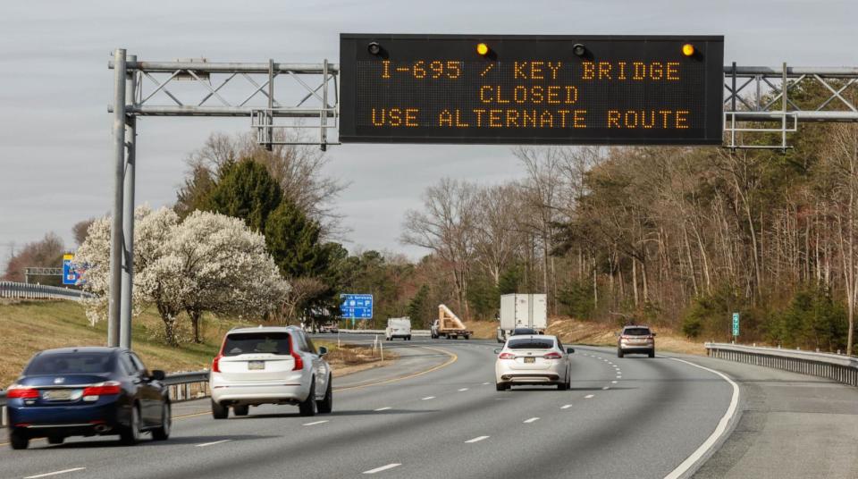 PHOTO: A traffic warning sign is displayed on Route 95 after a cargo ship collided with the Francis Scott Key Bridge causing it to collapse on March 26, 2024 in North East, Md. (Kena Betancur/Getty Images)