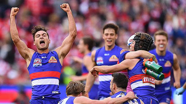 Luke Dahlhaus of the Bulldogs celebrates with teammates after winning the grand final. Pic: Getty