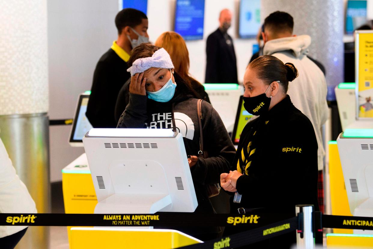 File photo of a passenger checking into Spirit Airlines flight  (AFP via Getty Images)