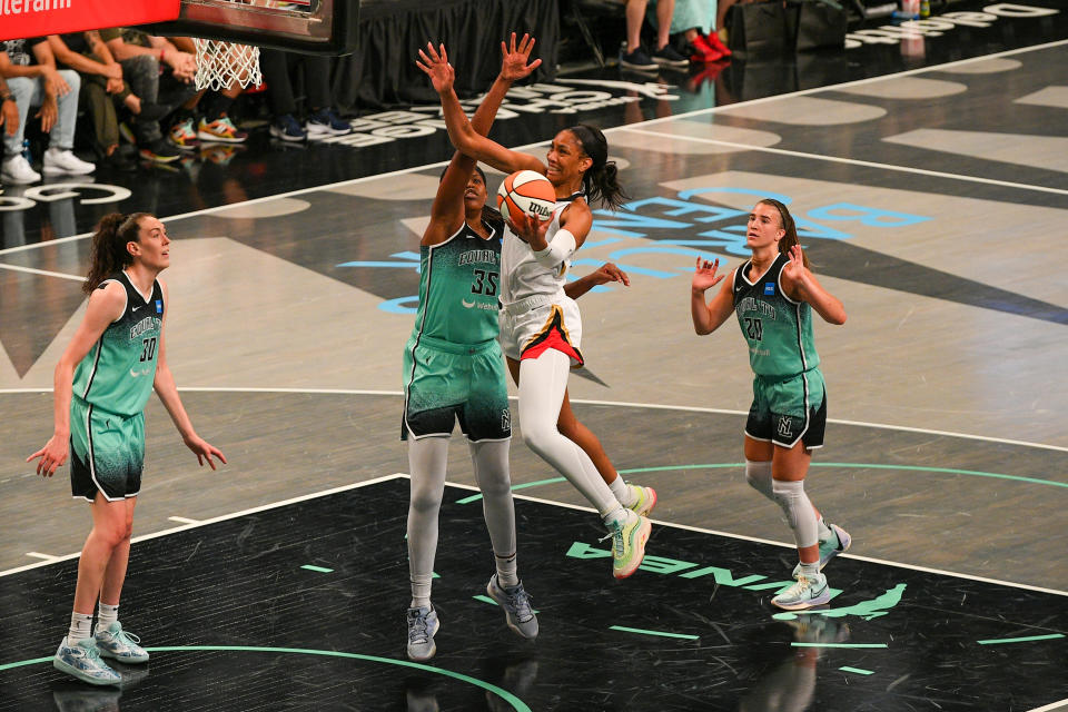 Las Vegas Aces forward A'ja Wilson shoots the ball while defended by New York Liberty forward Jonquel Jones on Aug. 6, 2023, at Barclays Center in New York. (Erica Denhoff/Icon Sportswire via Getty Images)