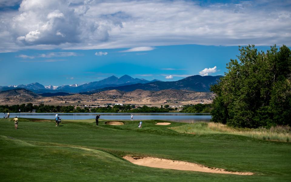 Korn Ferry Tour professionals play the scenic ninth hole, which has views of the foothills and peaks beyond during the final round of The Ascendant at TPC Colorado in Berthoud on July 3, 2022.