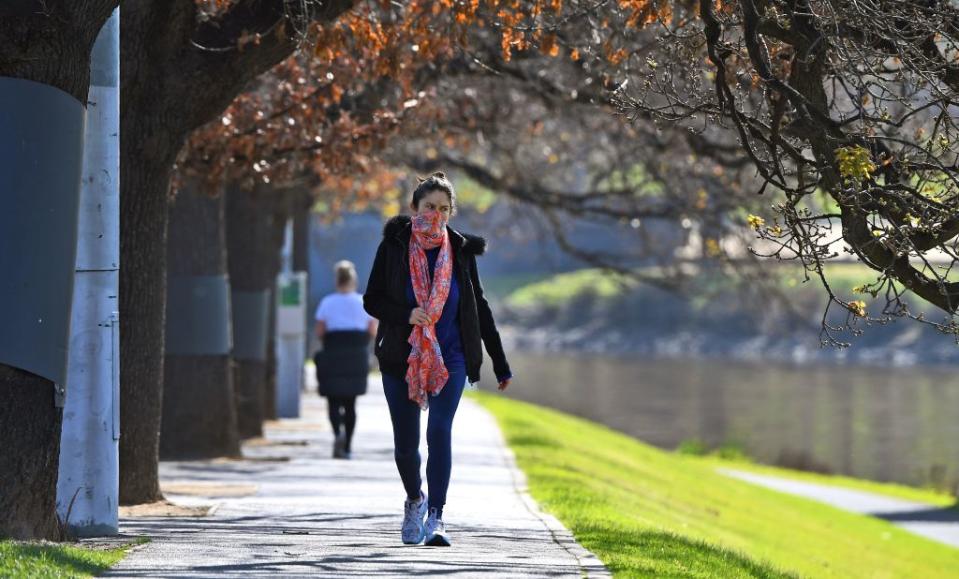 A woman exercises alongside the Yarra River in Melbourne this month during lockdown. Source: Getty