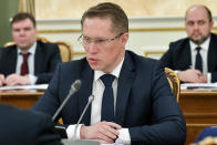 Russian Healthcare Minister Mikhail Murashko attends a coronavirus cabinet meeting with Russian Prime Minister Mikhail Mishustin in Moscow, Russia, Monday, March 30, 2020. Sobyanin ordered a lockdown starting Monday requesting all city residents except those working in essential sectors to stay home except in cases of medical emergency and shop only at nearby stores or pharmacies. New legislation is expected to be passed in the coming days to clear up questions over the legality of the new measures. The new coronavirus causes mild or moderate symptoms for most people, but for some, especially older adults and people with existing health problems, it can cause more severe illness or death. (Alexander Astafyev, Sputnik, Kremlin Pool Photo via AP)