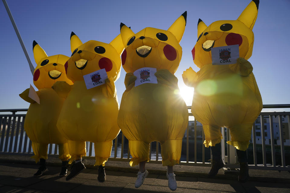 Activists dressed as the Pokemon character Pikachu protest against Japan's support of the coal industry near the COP26 U.N. Climate Summit in Glasgow, Scotland, Thursday, Nov. 4, 2021. The U.N. climate summit in Glasgow gathers leaders from around the world, in Scotland's biggest city, to lay out their vision for addressing the common challenge of global warming. (AP Photo/Alberto Pezzali)