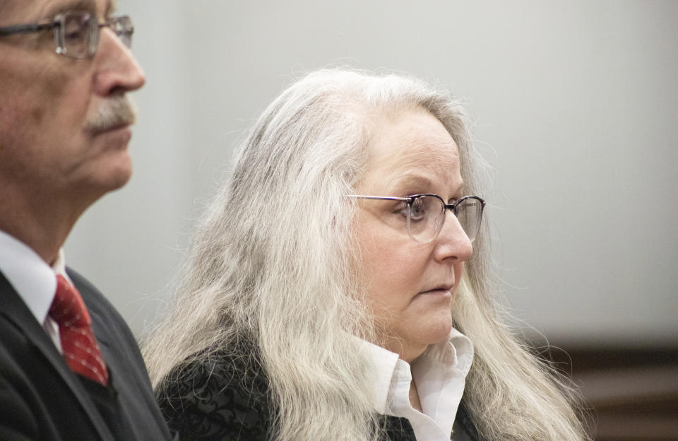 Kathy Funk and her attorney Philip H. Beauvais III appear in court, Wednesday, Jan. 25, 2023, in Flint, Mich. Funk, who was a public official in a Flint-area community admitted, Wednesday that she broke a seal on a ballot box to ensure that votes could not be recounted in her 2020 race, prosecutors said Brice Tucker. Funk, 59, pleaded no contest to misconduct in office, a felony, under an agreement that includes no time in jail. (Brice Tucker/The Flint Journal via AP)