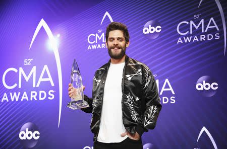 52nd Country Music Association Awards – Photo Room – Nashville, Tennessee, U.S., 14/11/2018. Thomas Rhett, winner of Music Video of the Year for "Marry Me", holds his award. REUTERS/Jamie Gilliam