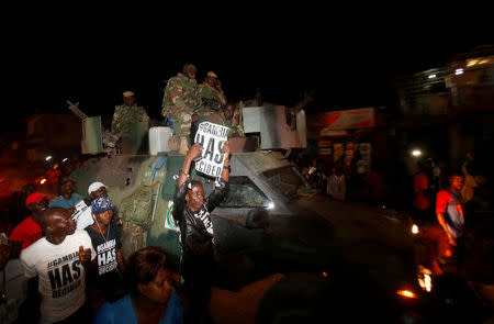 People celebrate the return of Gambia's new President Adama Barrow to the country, at the airport in Serekunda, Gambia January 26, 2017. REUTERS/Thierry Gouegnon