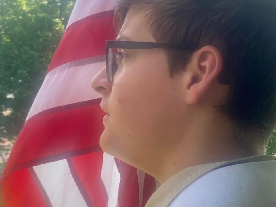 Joe Sporher, 14, of Boy Scout Troop 48 of Chatham looks on before the start of a Memorial Day service at Veterans Memorial Park. The service was put on by American Legion Post 759.