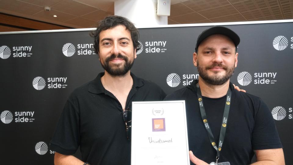 'Unwelcomed' directors Sebastian González Méndez and Amilcar Infante with their award at Sunny Side of the Doc.