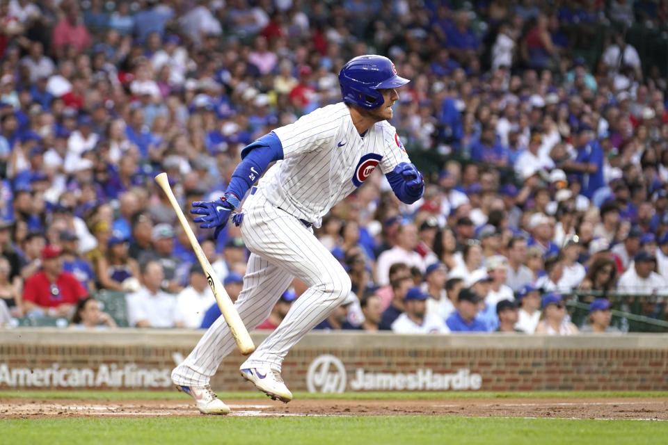Chicago Cubs' Cody Bellinger watches his RBI single off Cincinnati Reds starting pitcher Ben Lively during the first inning of a baseball game Tuesday, Aug. 1, 2023, in Chicago. (AP Photo/Charles Rex Arbogast)