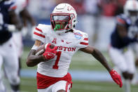 Houston wide receiver Nathaniel Dell (1) carries the ball after a reception against Auburn during the first half of an NCAA college football game Tuesday, Dec. 28, 2021, in Birmingham, Ala. (AP Photo/Butch Dill)
