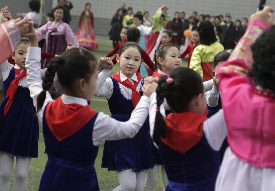 North Korean children dance during the election day at a polling station in Pyongyang, North Korea, Sunday, March 10, 2019. Millions of North Korean voters, including leader Kim Jong Un, are going to the polls to elect roughly 700 members to the national legislature. In typical North Korean style, voters are presented with just one state-sanctioned candidate per district and they cast ballots to show their approval or, very rarely, disapproval. (AP Photo/Dita Alangkara)