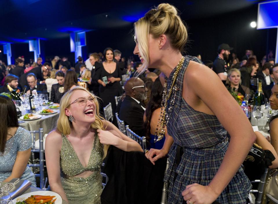 <em>Once Upon a Time...in Hollywood </em>actresses Dakota Fanning and Margot Robbie chat during the awards. 