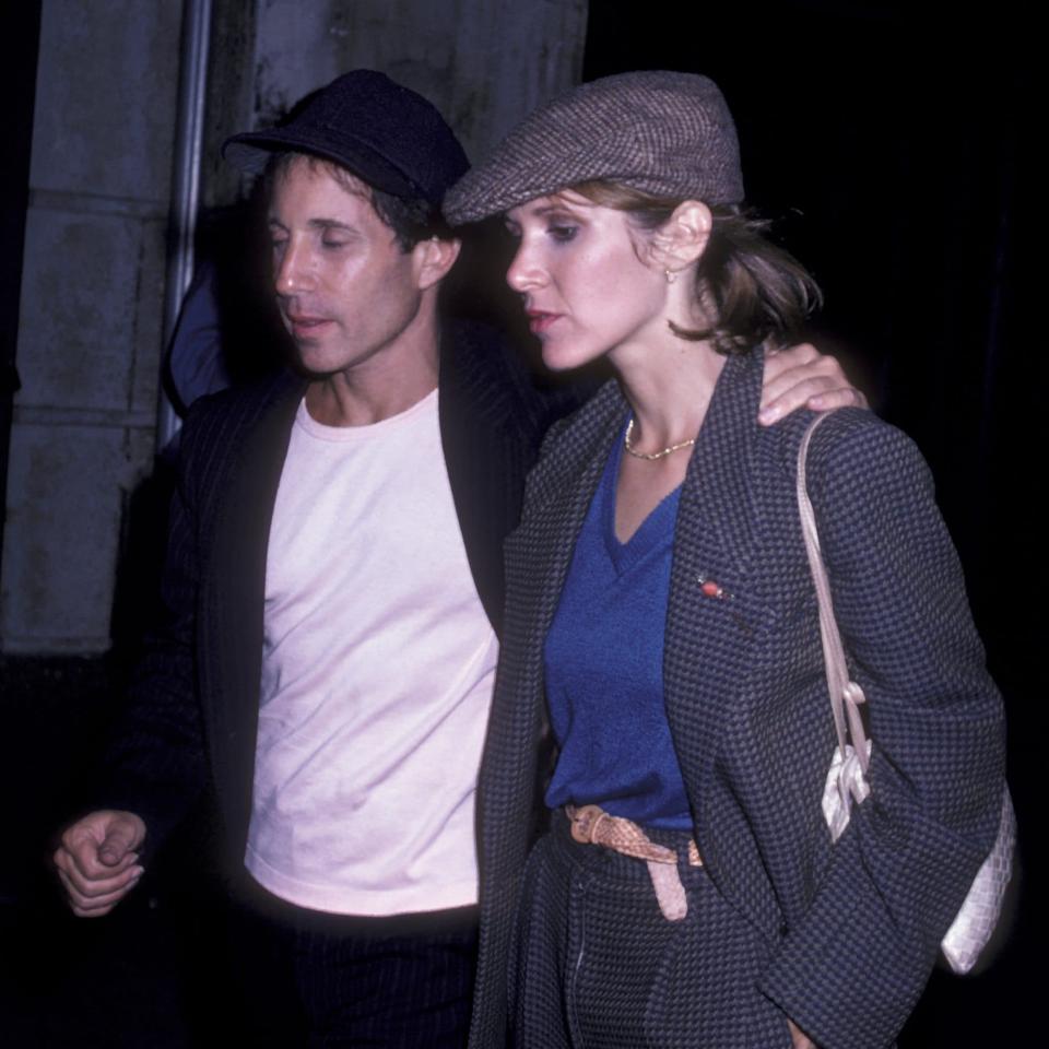 Paul Simon and his then-girlfriend Carrie Fisher backstage at Central Park - Getty