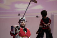 Florida Panthers goaltender Sergei Bobrovsky gives a young fan a stick after Bobrovsky was named one of the Stars of the Game after Game 3 of the NHL hockey Stanley Cup Eastern Conference finals against the Carolina Hurricanes, Monday, May 22, 2023, in Sunrise, Fla. (AP Photo/Wilfredo Lee)