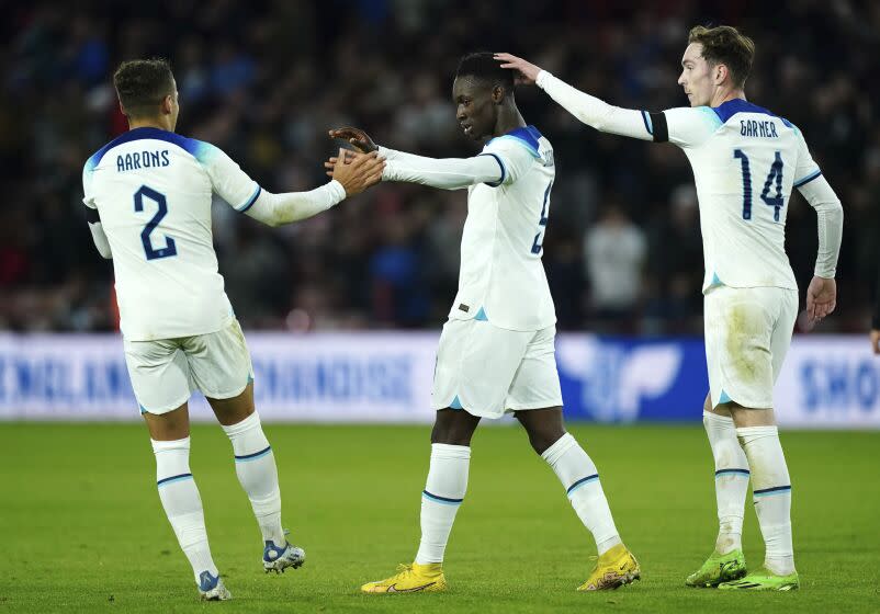 England's Folarin Balogun, centre, celebrates scoring their side's first goal of the game during the Under-21 International Friendly match between England and Germany at Bramall Lane in Sheffield, Tuesday Sept. 27, 2022. (Mike Egerton/PA via AP)
