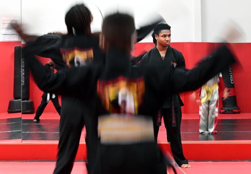 Carson, California February 3, 2023-Gregory Woodson, 17, instructs a karate class at Power of One Martial Arts in Carson. (Wally Skalij/Los Angeles Times)