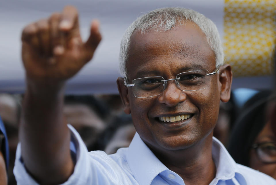 FILE - In this Monday, Sept. 24, 2018, file photo, Ibrahim Mohamed Solih, the president-elect of the Maldives interacts with his supporters during a gathering in Male, Maldives. The Maldives' top court has dismissed the outgoing president's petition seeking an annulment of last month's presidential election results. The Election Commission had declared opposition alliance candidate Ibrahim Mohamed Solih the winner of the Sept. 23 election against President Yameen Abdul Gayoom. (AP Photo/Eranga Jayawardena, File)