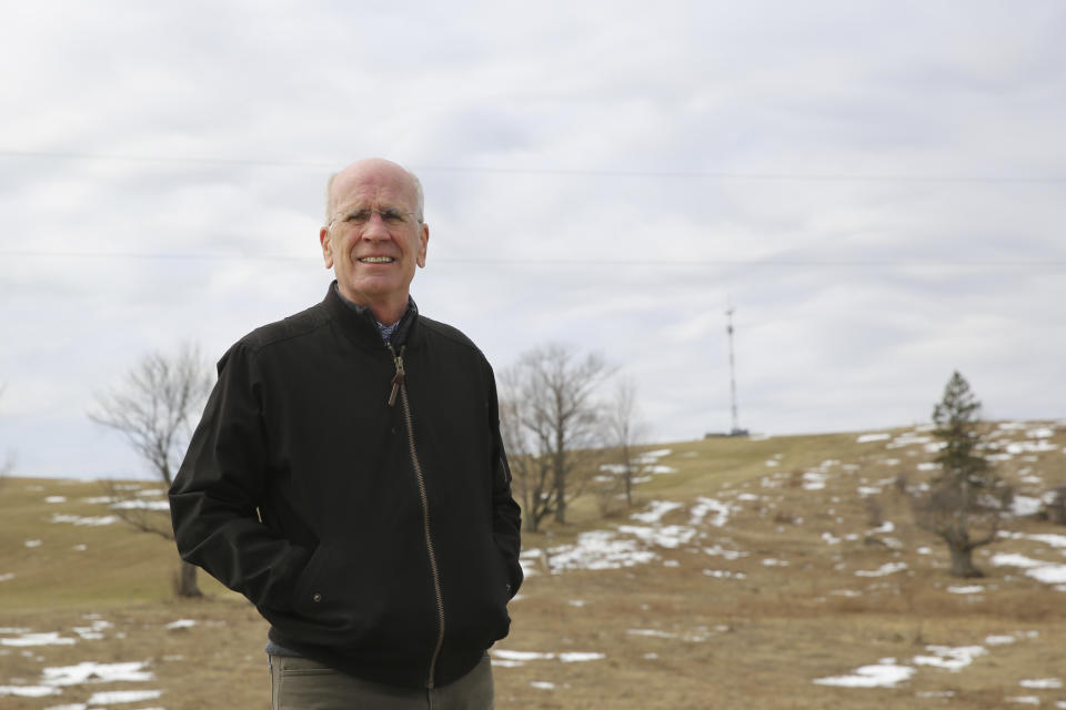 Democratic U.S. Rep. Peter Welch stands for a photograph on a road in Derby Line, Vt., Monday, April 5, 2021. Welch spoke at a news conference about a plan to install surveillance towers along the Vermont border with the Canadian province of Quebec. Behind him is a temporary tower on the spot where a permanent, larger tower would be located. Welch and others say they want to know more about the proposal. U.S Customs and Border Protection say the towers would provide them with more surveillance and detection capabilities along the border. (AP Photo/Wilson Ring)