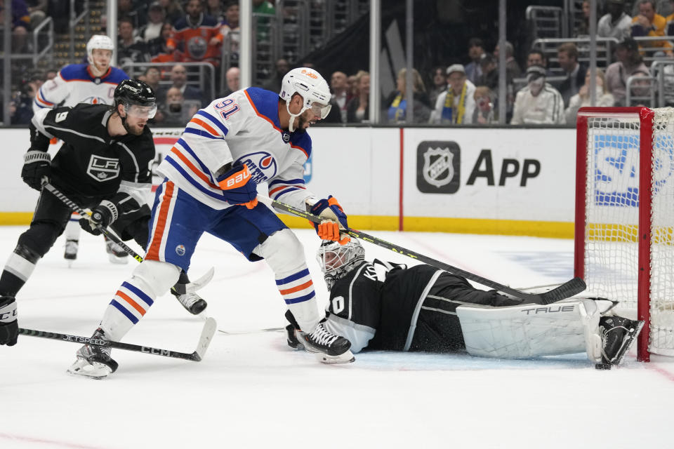 Edmonton Oilers left wing Evander Kane (91) shoots against Los Angeles Kings goaltender Joonas Korpisalo (70) during the third period of Game 4 of an NHL hockey Stanley Cup first-round playoff series hockey game Sunday, April 23, 2023, in Los Angeles. (AP Photo/Ashley Landis)