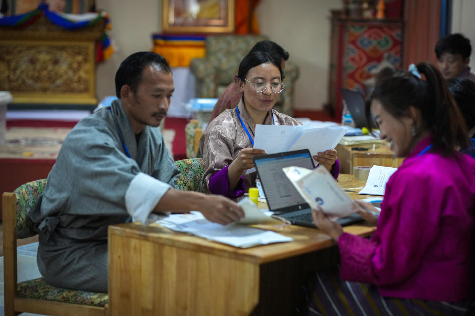 Election officials sort postal ballots ahead of Tuesday's general election at the Deputy Commissioners office in Samdrup Jongkhar, Bhutan, Sunday, Jan. 7, 2024. (AP Photo/Anupam Nath)