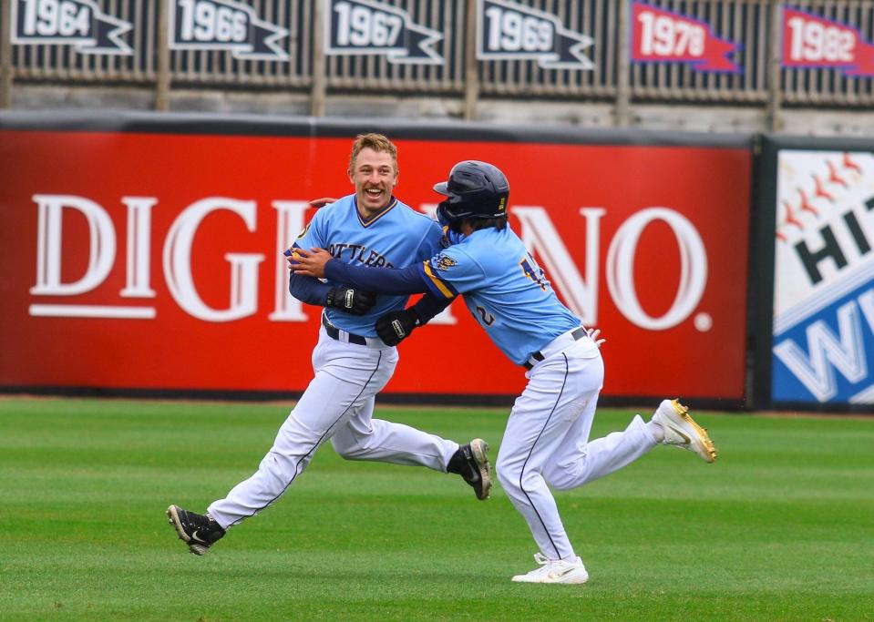 Catcher Alex Hall, shown celebrating with the Class A Wisconsin Timber Rattlers, received a call Thursday to join the Brewers after Omar Narváez was placed on the COVID-19 IL.