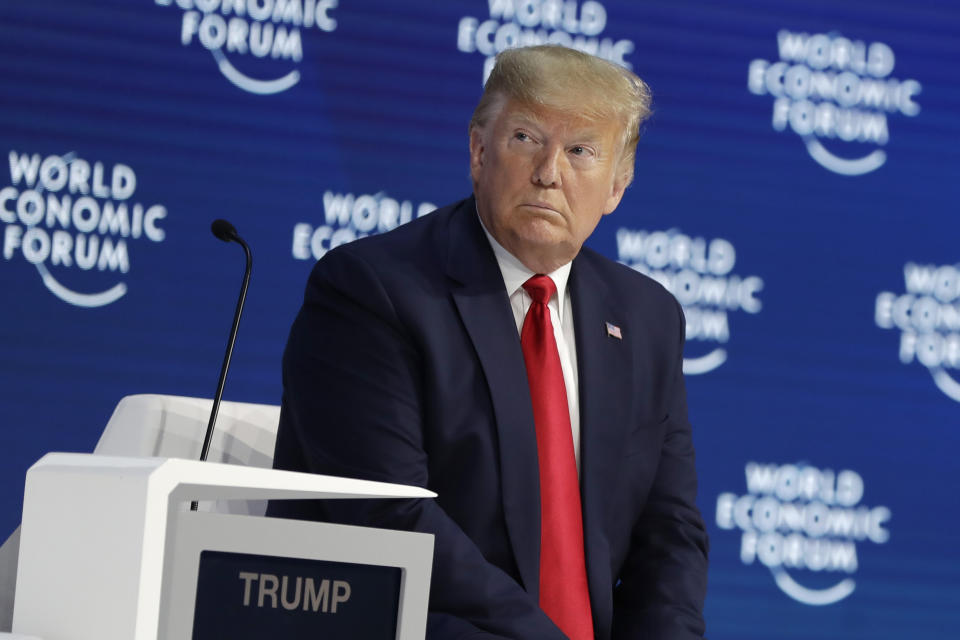 President Donald Trump listens before delivering the opening remarks at the World Economic Forum, Tuesday, Jan. 21, 2020, in Davos. (AP Photo/ Evan Vucci)