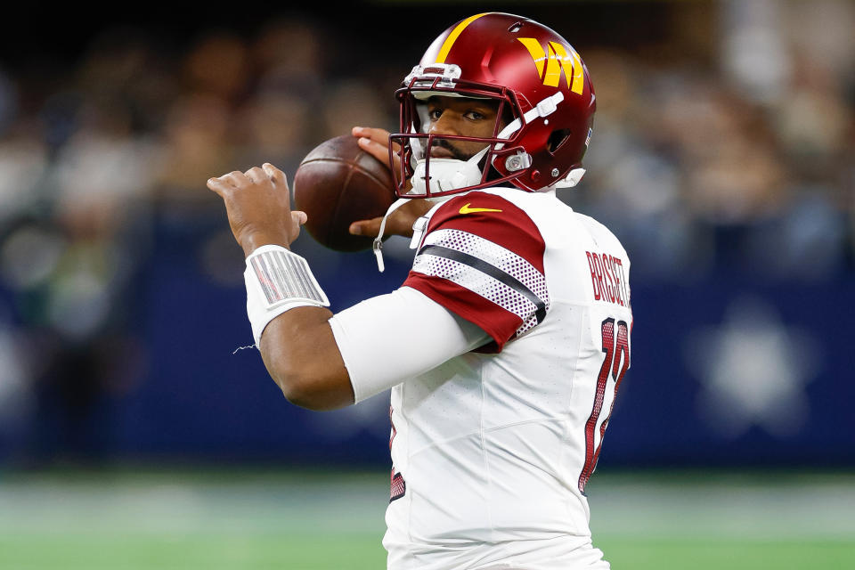 ARLINGTON, TEXAS - NOVEMBER 23: Jacoby Brissett #12 of the Washington Commanders throws the ball in a timeout against the Dallas Cowboys during the first half at AT&T Stadium on November 23, 2023 in Arlington, Texas. (Photo by Brandon Sloter/Image Of Sport/Getty Images)