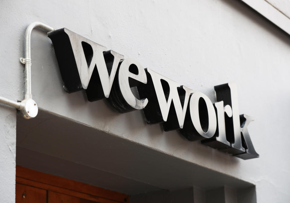 Signage outside the co-working office space group, WeWork, at Chapel Street, London. (Photo by Jonathan Brady/PA Images via Getty Images)