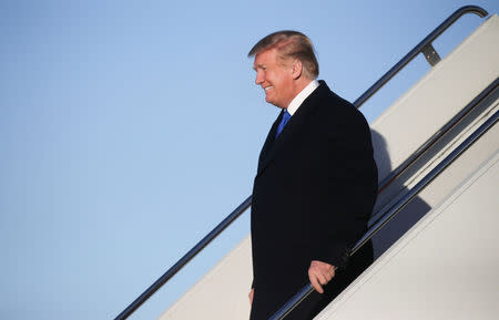 U.S. President Donald Trump exits Air Force One arriving from his summit meeting with North Korea's Kim Jong Un in Vietnam after landing for a refueling stop at Elmendorf Air Force Base in Anchorage, Alaska, U.S., February 28, 2019. REUTERS/Leah Millis