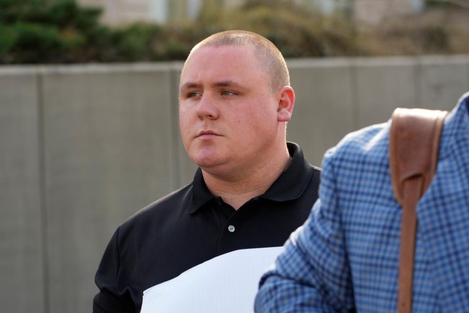 Former City of Pearl, Miss., police Officer Michael Christian Green walks out of the federal courthouse in Jackson, Miss., Thursday, March 14, 2024, after pleading guilty to a federal misdemeanor charge after authorities said he forced a man he had arrested to lick urine off the floor of a jail cell.