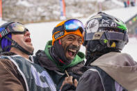 London-born Meka Lebohang Ejindu, center, reacts after his run during the Winter Win Slopestyle snowboard and ski competition at the Afriski ski resort near Butha-Buthe, Lesotho, Saturday July 30, 2022. While millions across Europe sweat through a summer of record-breaking heat, Afriski in the Maluti Mountains is Africa's only operating ski resort south of the equator. It draws people from neighboring South Africa and further afield by offering a unique experience to go skiing in southern Africa. (AP Photo/Jerome Delay)
