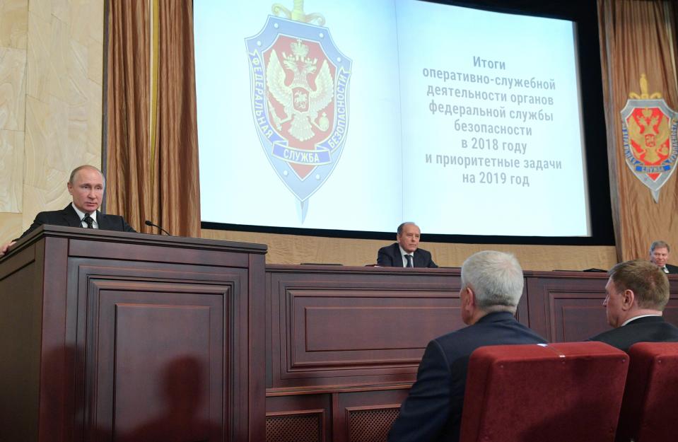 Russian President Vladimir Putin, left, speaks as Alexander Bortnikov, head of the Federal Security Service (FSB), second right, attends a meeting with top officials of the Federal Security Service (FSB) at its headquarters in Moscow, Russia, Wednesday, March 6, 2019. Putin urged the agency to tighten the protection of information related to new weapons. (Alexei Druzhinin, Sputnik, Kremlin Pool Photo via AP)