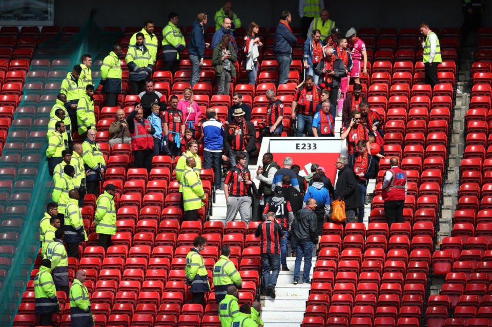 Fans are evacuated before the match between Manchester United and AFC Bournemouth at Old Trafford was abandoned on May 15, 2016, in Manchester, England. (Alex Livesey/Getty Images)