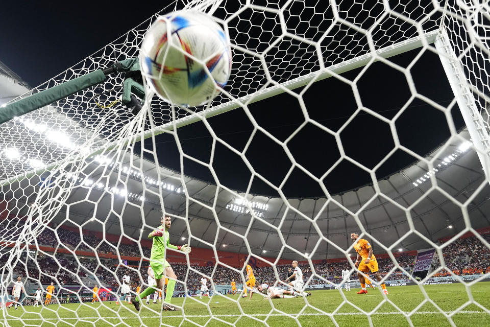 Daley Blind of the Netherlands scores his side's second goal during the World Cup round of 16 soccer match between the Netherlands and the United States, at the Khalifa International Stadium in Doha, Qatar, Saturday, Dec. 3, 2022. (AP Photo/Francisco Seco)