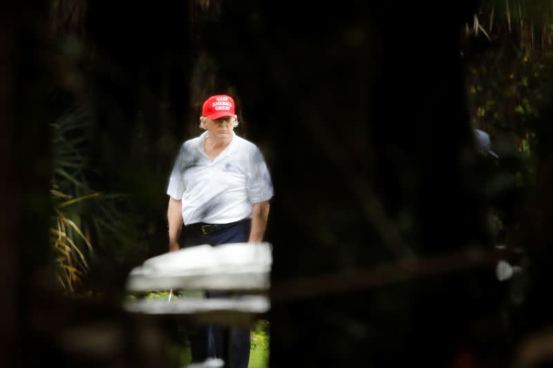 U.S. President Donald Trump plays golf at the Trump International Golf Club in West Palm Beach